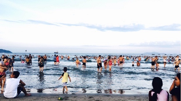  Local residents and visitors at the My Khe beach