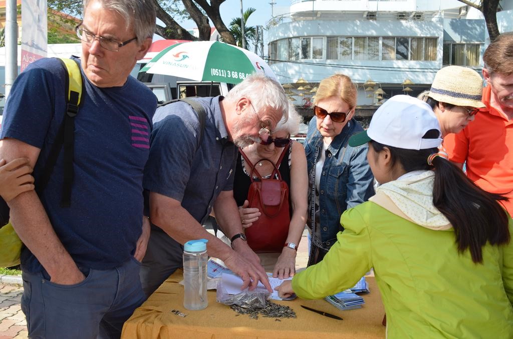 Foreign visitors at a tourist information desk