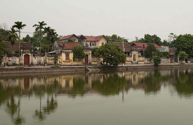  Reflections of the village in a pond