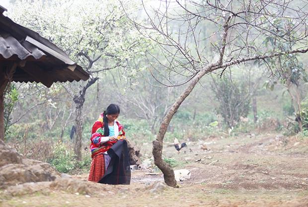 A woman makes a skirt for the upcoming Lunar New Year festival.