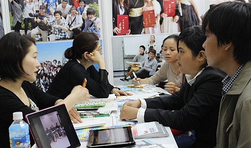 Vietnamese students learn about education in Japan at a study abroad fair in Ho Chi Minh City.