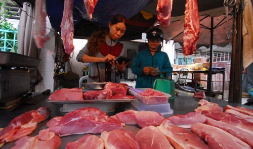 A pork vendor at Go Vap Market in Go Vap District, Ho Chi Minh City