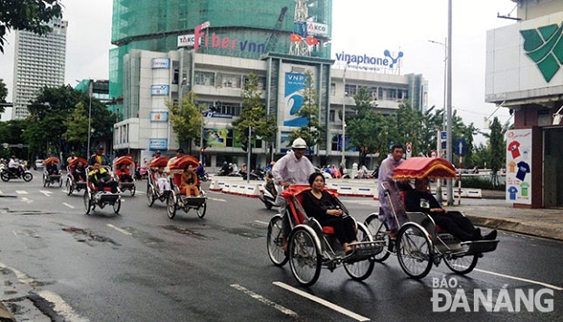 Visitors enjoying a city tour by cyclo