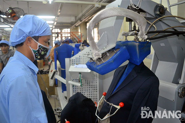 A worker at a local textiles and garments company 