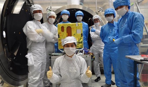 Vietnamese engineers and their self-built Micro Dragon satellite at the Vietnam National Satellite Center in Ha Noi