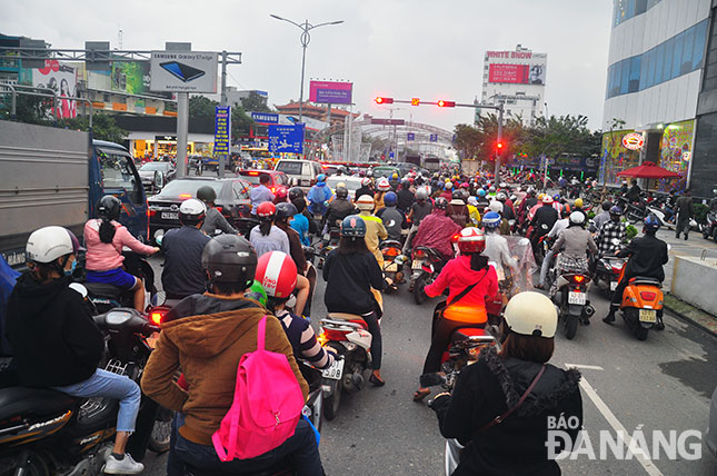 People waiting at traffic lights   