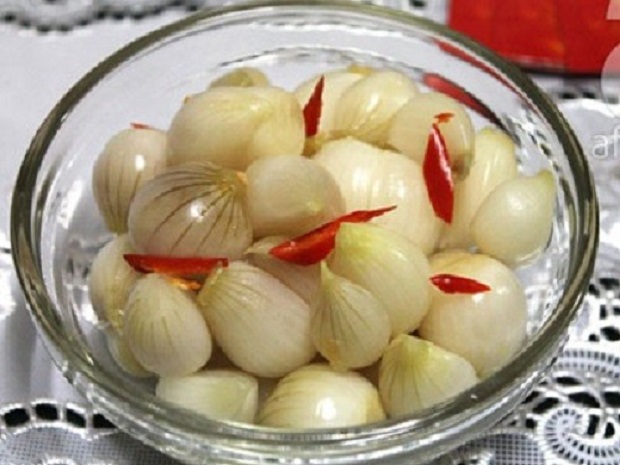 Sour and spicy: 'dua hanh' (pickled welsh onion) helps digest a heavy Tet meal.