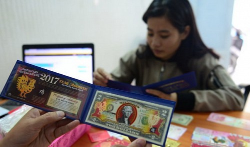 A fake two-dollar bill with imprinted roosters is sold at a store in Ho Chi Minh City. Tuoi Tre