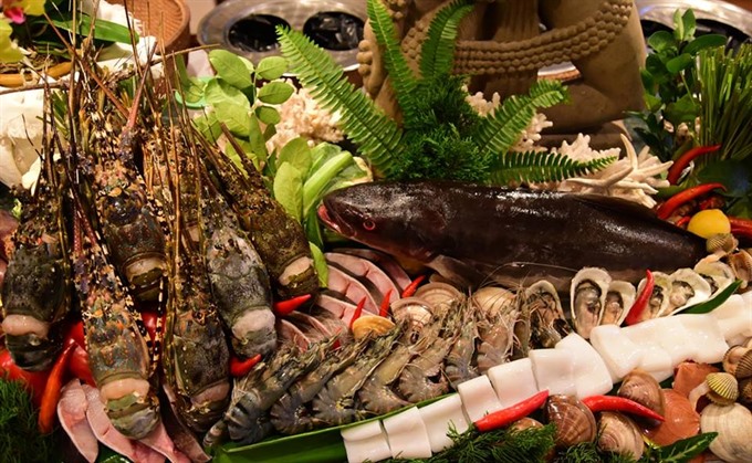 A Tết (Lunar New Year) seafood dinner buffet will open at the Café Indochine Restaurant in Furama Resort Đà Nẵng through February 1st. VNS Photo Trương Ngọc Thành Read more at http://vietnamnews.vn/ovietnam/350334/tet-buffet-opens-for-tourists-and-expats.html#vVkDmCSehBAkkkvG.99