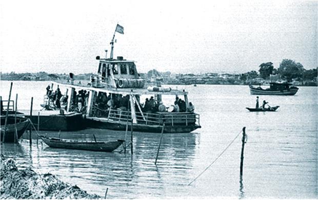 A small ferry carrying passengers across the Han River in the past …