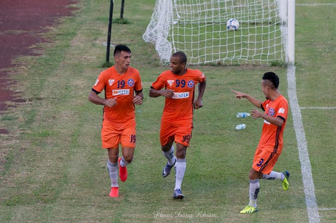 SHB DN players celebrate after scoring a goal in a match of the national football championship 