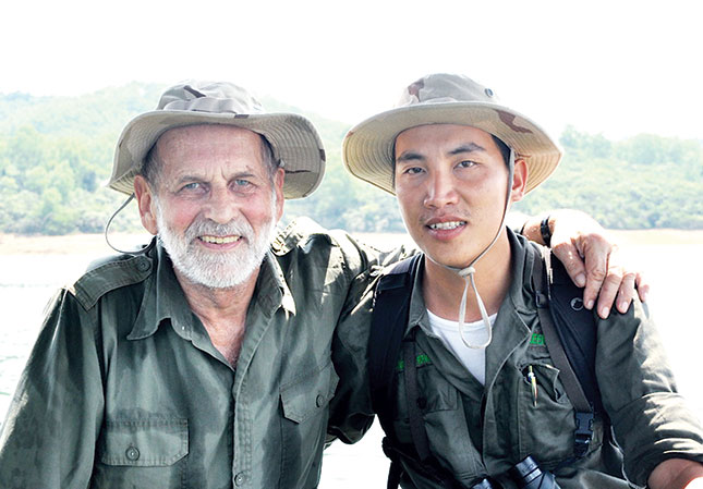 Mr Tuan (right) and a foreign friend during their research into the red-shanked douc langurs