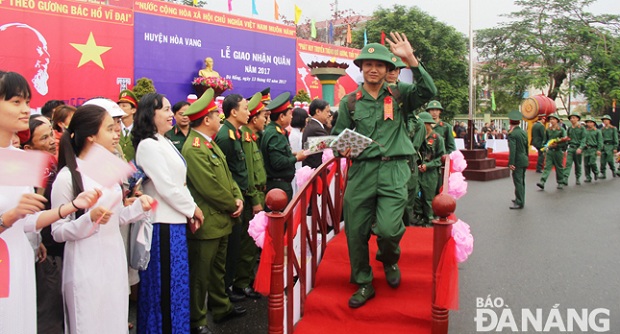   New recruits walking over the ‘Vinh Quang’ (Glory) Bridge