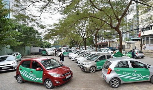 GrabCar vehicles are seen in this photo posted on the Facebook page of Grab Vietnam.