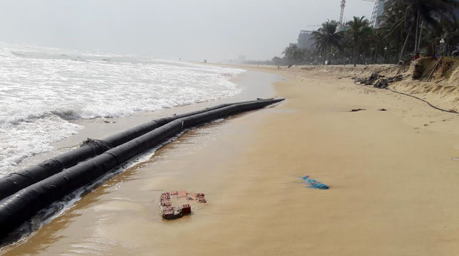   An oil pipeline surfaces on the beach