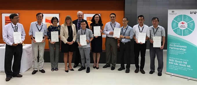 Australian Consul General Karen Lanyon (fourth from left) and DAP recipients at a ceremony to award aid grants in the 2016-17 period. — Photo courtesy of the Australian Consulate General in HCM City Read more at http://vietnamnews.vn/economy/351724/australia-aids-community-infrastructure-projects.html#BIsrClU4l3KhuFAl.99