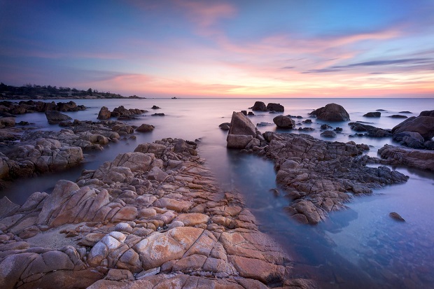 The rocks are shaped by the sea and tides