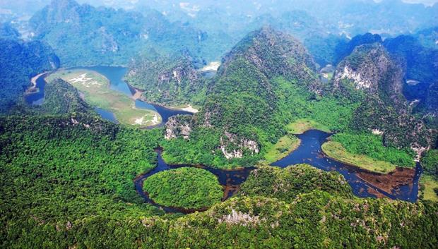 Its grottoes consist of a handful of caves and rocks towering out from a large network of canals and lakes. Trang An was listed on the UNESCO World Heritage List of Natural and Cultural Sites in June 2014. Photo courtesy of Management Board of Trang An Scenic Landscape Complex