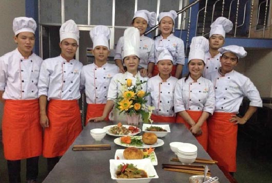Mrs Thanh (centre front) and her trainees