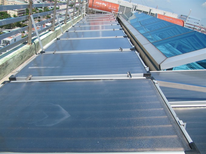 Solar panels on the roof of a residential apartment in Đà Nẵng. Thirty per cent of the city’s population are using solar powered water-heaters. — VNS Photo Công Thành Read more at http://vietnamnews.vn/society/373154/four-central-cities-join-one-planet-city-challenge.html#GK44HKJXT7pHOsGf.99
