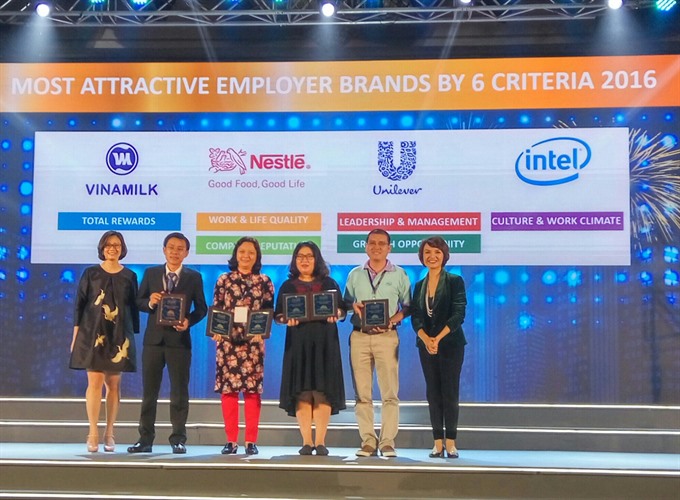Companies receive awards at a ceremony for Việt Nam’s 100 Best Places to Work 2016. The winners were announced on Wednesday in HCM City. — VNS Photo Thu Hằng Read more at http://vietnamnews.vn/economy/373329/viet-nams-100-best-places-to-work-revealed.html#4E21R0gyCp4bgqwH.99