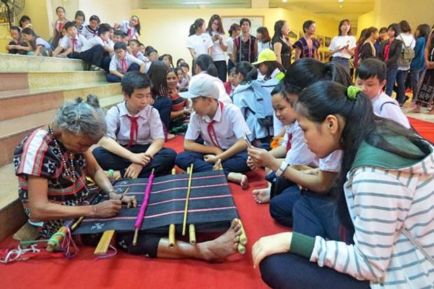 75-year-old Mrs Srah Rem, also from Nam Giang District, weaving brocade