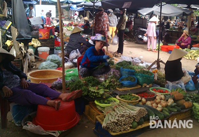 Traders and shoppers at a local rural market 