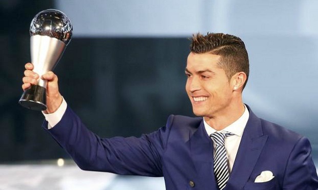 Cristiano Ronaldo celebrates with FIFA's player of the year award in January. Photo by Reuters/Ruben Sprich
