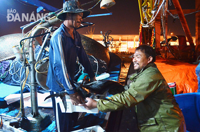 Fishermen busy making preparations for a trip