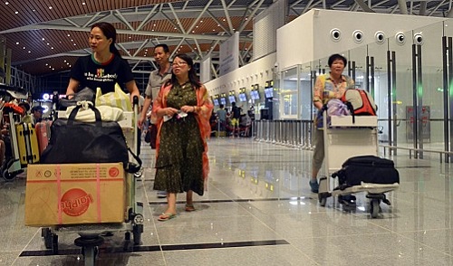 Passengers push their luggage at the new T2 international terminal at Da Nang International Airport. Tuoi Tre