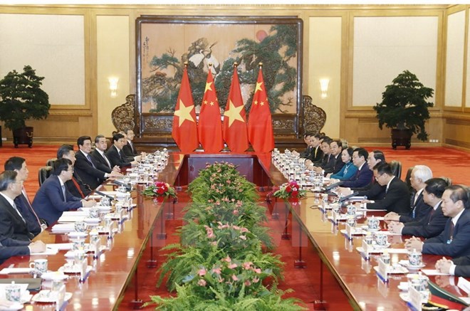 The talks between China’s Party General Secretary and President Xi Jinping and President Tran Dai Quang (Source: VNA)