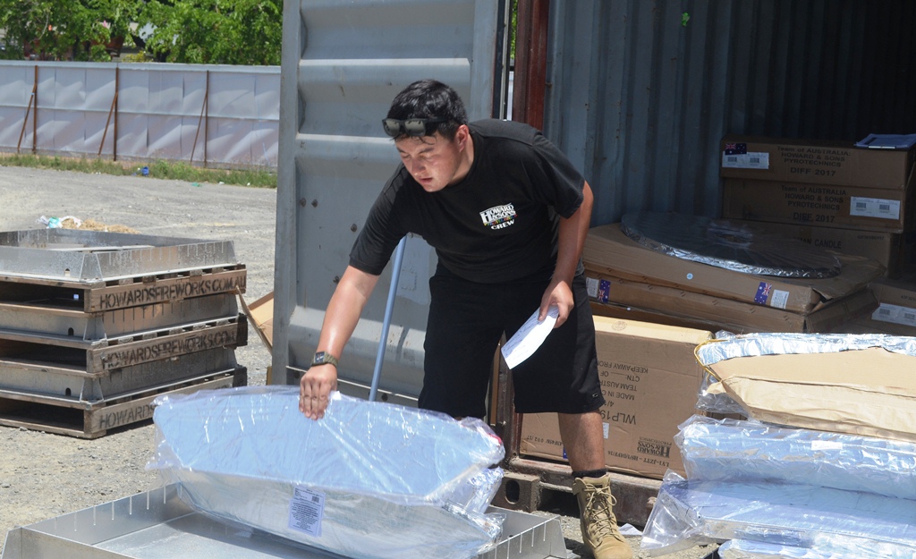 Another Australian team member completing the final installation of fireworks.