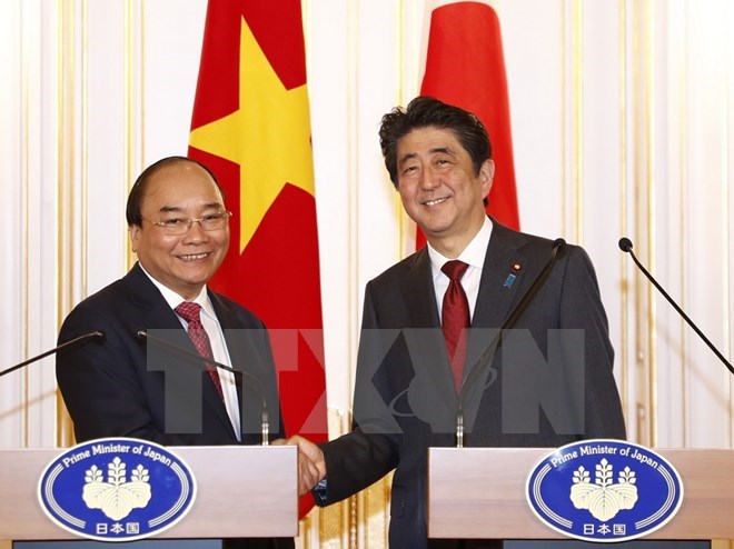 Prime Ministers Nguyen Xuan Phuc and Shinzo Abe at the press conference (Source: VNA)