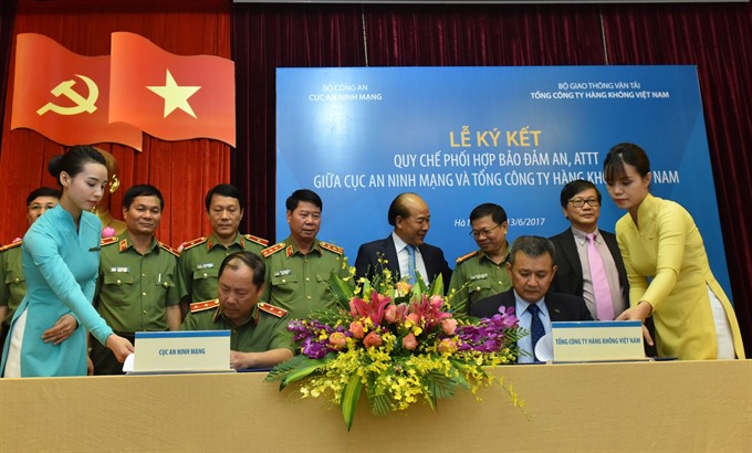 The two sides sign a deal on cyber security and information safety witnessed by leaders of the public security ministry and the transport ministry. 