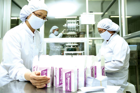 Workers at a production line of a foreign pharmaceutical firm in Viet Nam. — Photo baodauthau.vn