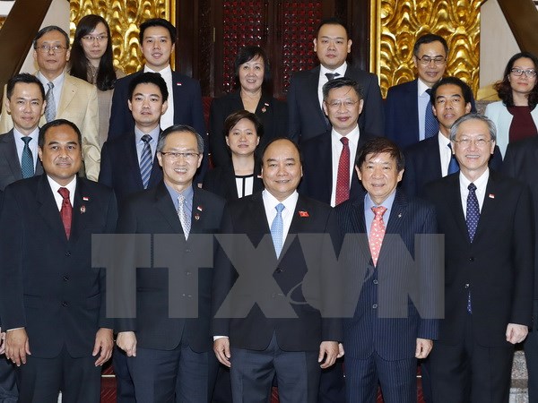 Thủ tướng Nguyễn Xuân Phúc tiếp ông Khaw Boon Wan, Chủ tịch Đảng Hành động Nhân dân Singapore (PAP), Bộ trưởng Điều phối Cơ sở hạ tầng, Bộ trưởng Giao thông Singapore. (Ảnh: Thống Nhất/TTXVN)