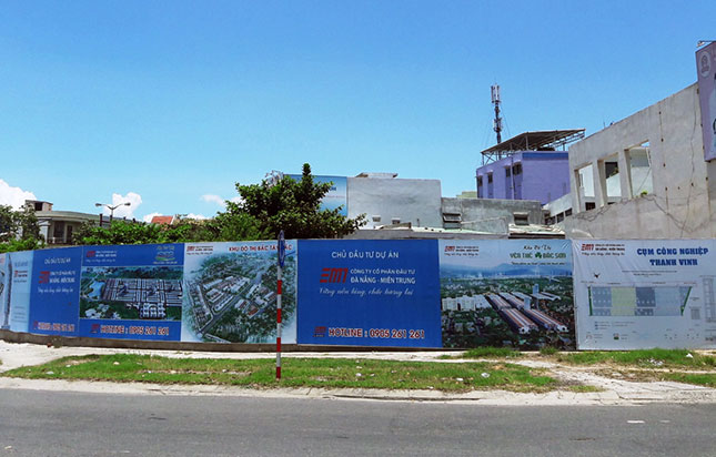 A vacant land lot fenced off with metal sheeting