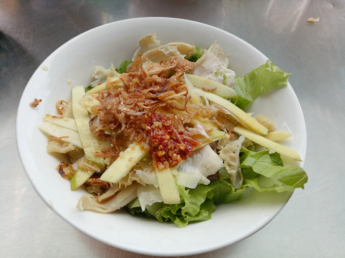 Pha lau is an exotic Vietnamese dish filled with pig or cow innards and cooked with herbs and seasoning in a stew similar to a curry, although not as spicy. It is usually served with bread.. Huong's shop at the entrance charges VND20,000 (less than $1) a bowl.