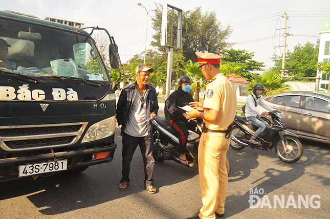 A traffic police officer inspecting a car driver