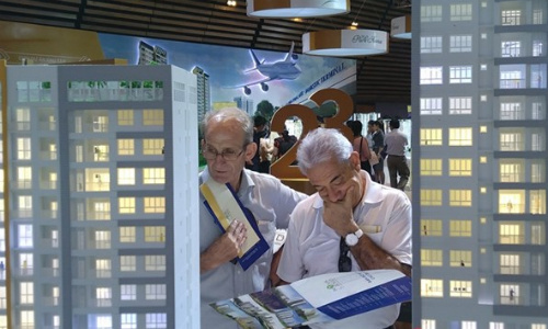 Foreign men check out a real estate project in Vietnam. Photo by VnExpress 