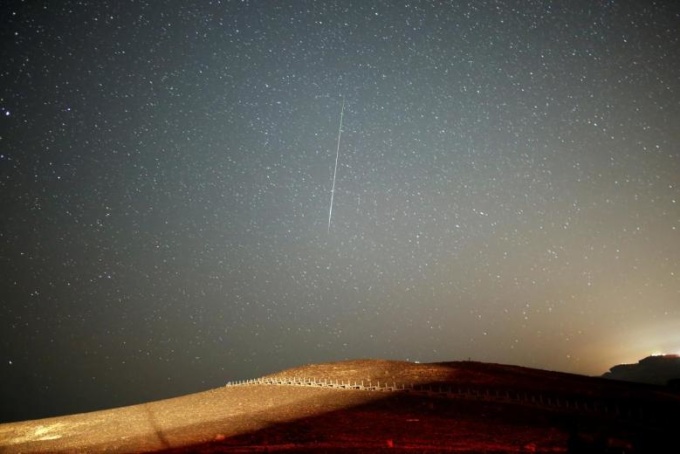 A Perseid meteor streaks across the sky in August 2016. Photo by Reuters 