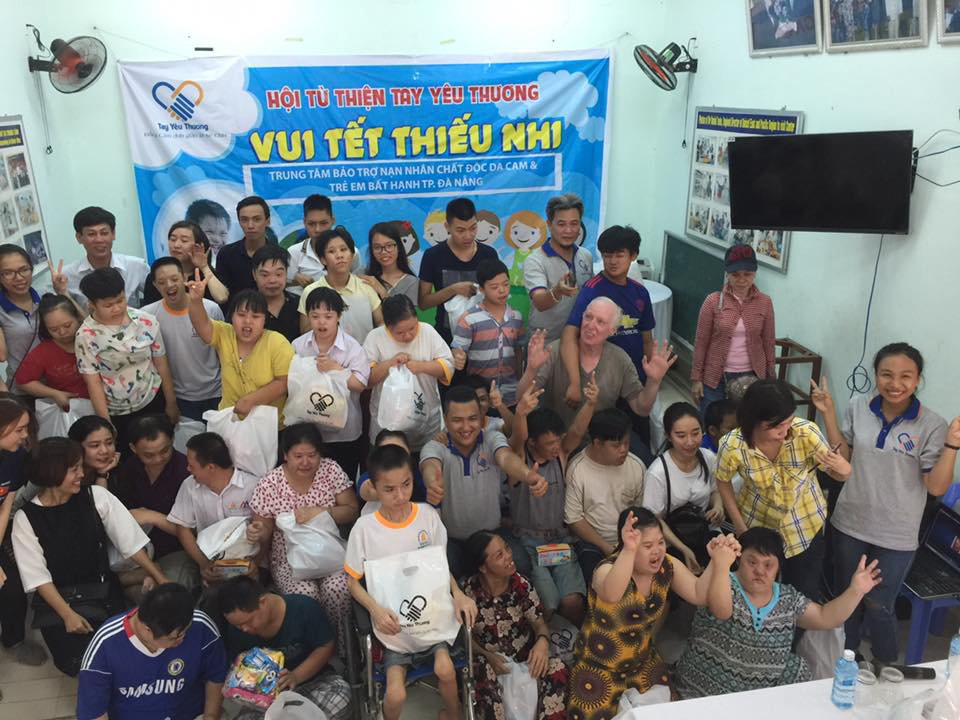 The group’s members and AO-affected victims at a charitable programme