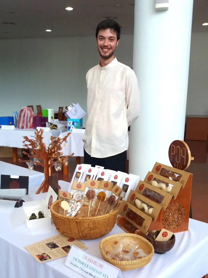 The smiling man with his candies at the exhibition