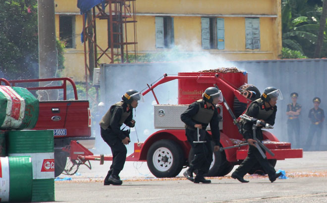 Another group of policemen searching for the location of mines