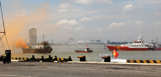 Rescuers from the Viet Nam Maritime Administration conducting firefighting activities on burning cargo ship