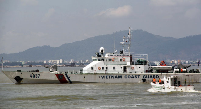 The Viet Nam Coast Guard ship approaching the burning cargo ship