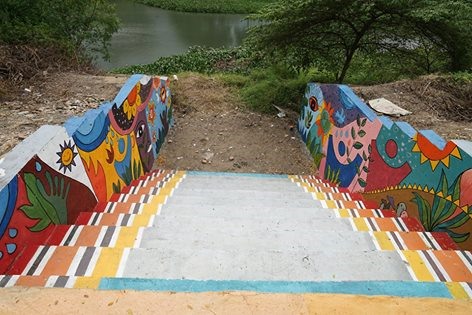 Lively walk: Colourful painted stairs create an art space for pedestrians and tourists on the Cẩm Lệ River in Đà Nẵng. — Photos courtesy of I love Cẩm Lệ facebook Read more at http://vietnamnews.vn/life-style/392853/students-create-river-side-art-space.html#GehTbockY83BXohT.99