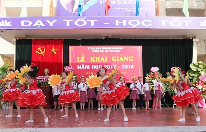 Pupils of the Vinh Hung School stage a musical performance