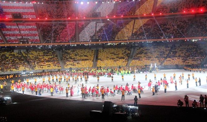 Vietnamese athletes parade at the opening ceremony of the ninth ASEAN Para Games