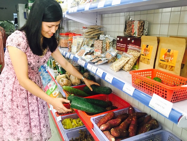 A shopper at a local store selling organic and safe agricultural products